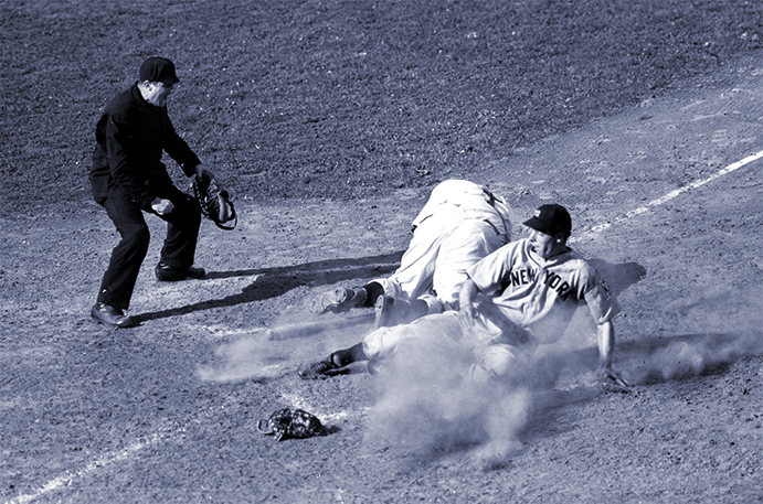 Joe DiMaggio slides past a dazed Ernie Lombardi in the 1939 World Series