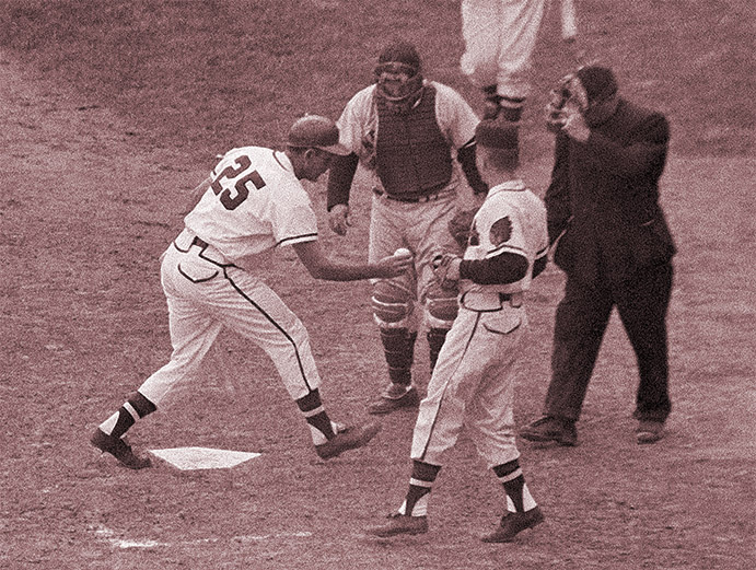 Nippy Jones shows umpire shoe-polished ball in 1957 World Series