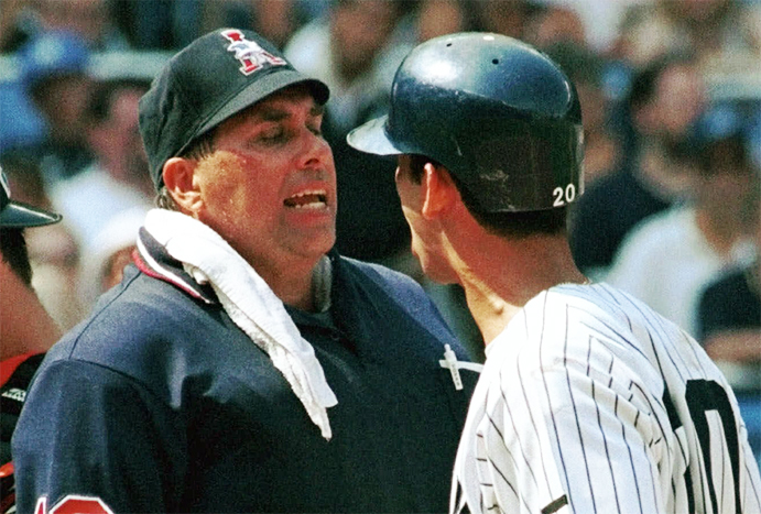 Greg Kosc and Jorge Posada argue a call