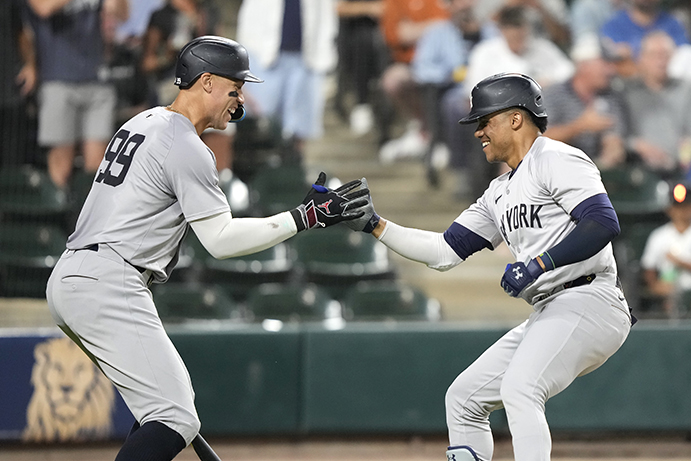 Aaron Judge and Juan Soto celebrate one of 99 home runs hit between the two Yankees in 2024.